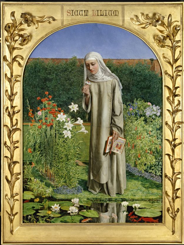 Painting. A pale-skinned woman wearing a white nun’s habit that covers her head, neck, and shoulders over an off-white robe stands in a garden. She is reflected in a pond near her feet. She holds an open book by her side and looks at a white flower she holds in her other hand. The painting has an arched top and is set in a gold frame with lilies in relief up each side.